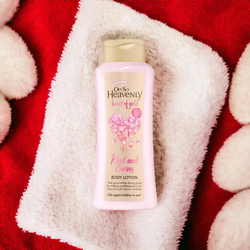 Oh So Heavenly Heart of Gold Body Lotion (720ml) on a soft towel, ideal for hydrating and brightening skin.